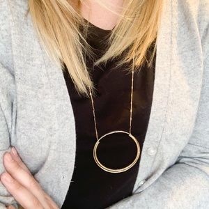Anthro Mixed metal long circle pendant necklace.